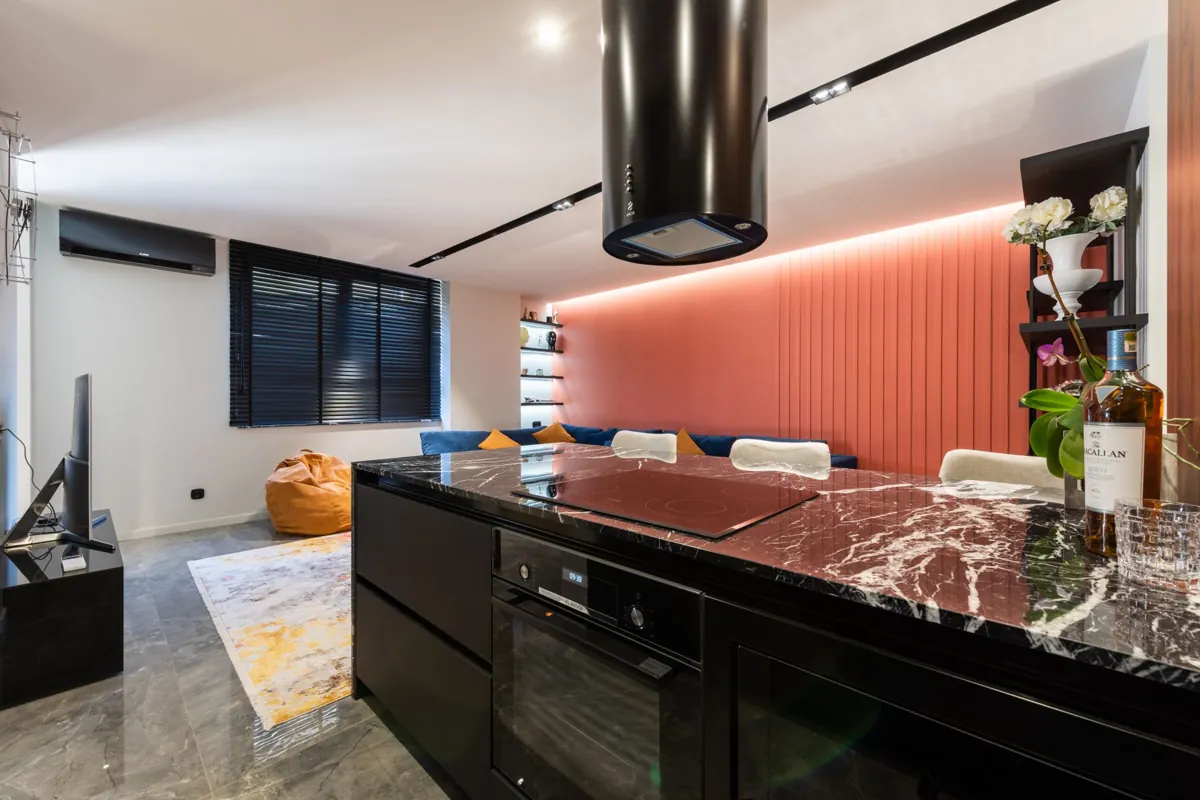 A kitchen extraction hood suspended above an island