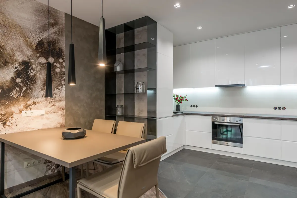 A fitted kitchen with lighting, an oven and a hob